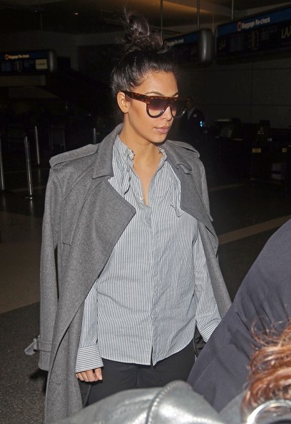Pregnant Kim Kardashian Arriving On A Flight At LAX