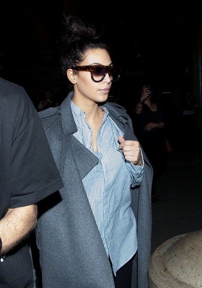 Pregnant Kim Kardashian Arriving On A Flight At LAX