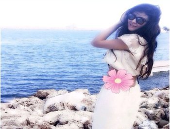 صور مريم حسين بفستان ابيض طويل على شاطئ البحر 2014