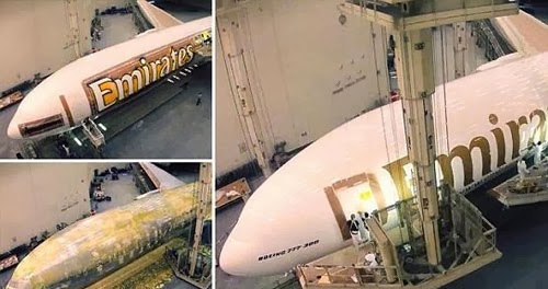 بالفيديو شاهد طريقة إعادة طلاء طيارة بوينغ 777 في طيران الإمارات