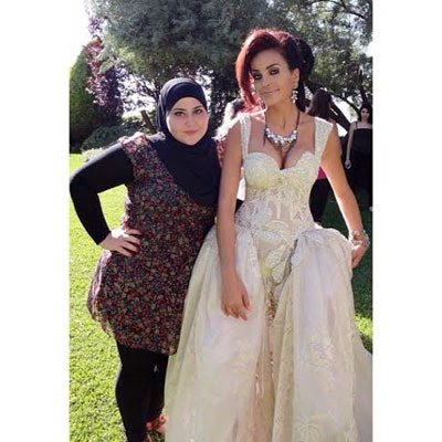 صور دومينيك حوراني بفستان زفاف انيق في كليب مالك 2014