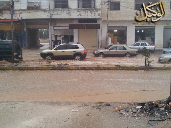 صور تساقط الأمطار في مدينة اربد اليوم الاحد 19/10/2014