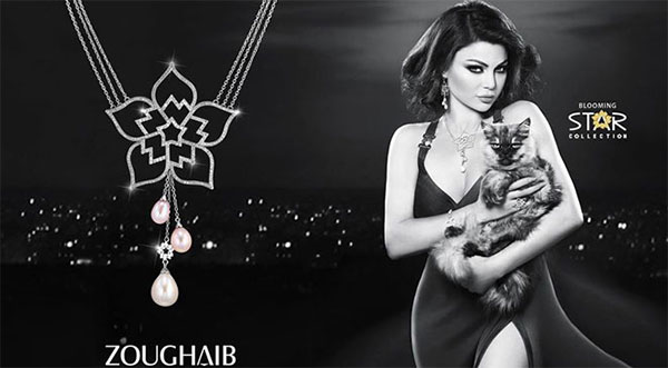 صور قمر اللبنانية بشعر أشقر وفستان مشقوق على غلاف ألبومها الجديد 2015