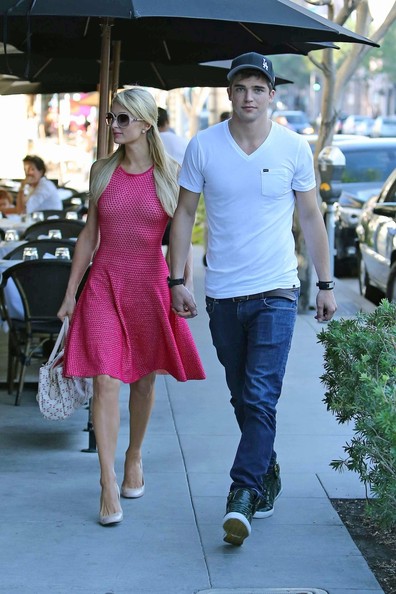 Paris Hilton catches a ride from her boyfriend, River Viiperi, before the couple head