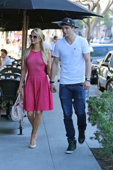 Paris Hilton catches a ride from her boyfriend, River Viiperi, before the couple head
