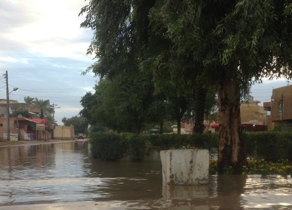 صور أمطار العراق 2013 - بغداد تغرق في بحيرات من مياه الامطار التي  لم يشهد لها مثيل منذ اكثر من 30 سنة